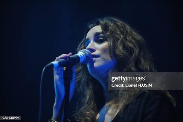 Agathe Moi performs on stage at the Arena of Geneve.