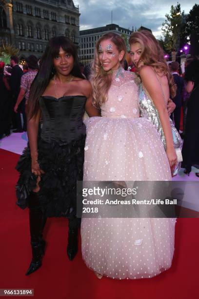 Rose May Alaba, Vera Boehnisch and Zoe Straub arrive for the Life Ball 2018 at City Hall on June 2, 2018 in Vienna, Austria. The Life Ball, an annual...
