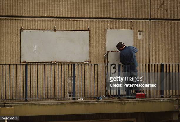 Workman welds shut doors and windows on an empty flat on the Heygate housing estate near Elephant and Castle on February 11, 2010 in London, England....