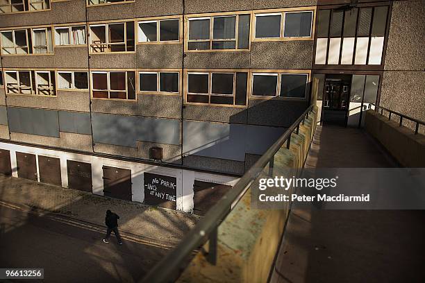 Man walks in late afternoon sunshine on the Heygate housing estate near Elephant and Castle on February 11, 2010 in London, England. The Heygate...