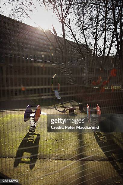 An empty children's playground is bathed in late afternoon sunshine on the Heygate housing estate near Elephant and Castle on February 11, 2010 in...
