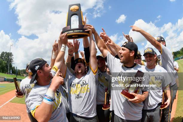Augustana Vikings players celebrate with the trophy after a win against the Columbus State Cougars during the Division II Men's Baseball Championship...