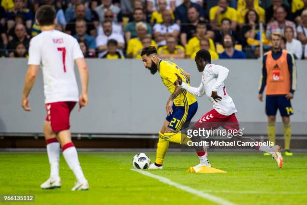 Jimmy Durmaz of Sweden in a duel with Pione Sisto of Denmark during an international friendly match between Sweden and Denmark at Friends Arean on...