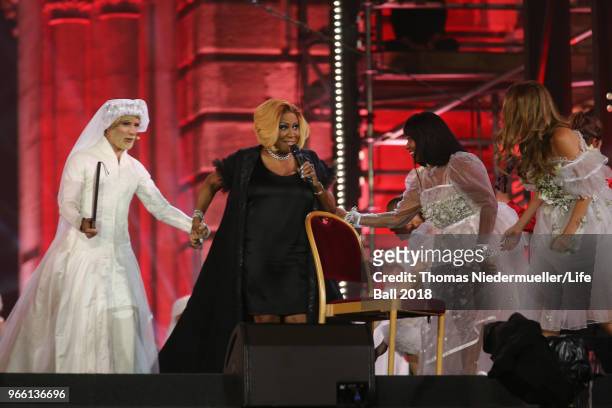 Conchita Wurst, Patty LaBelle, Rose Alaba and Zoe Straub perform on stage during the Life Ball 2018 show at City Hall on June 2, 2018 in Vienna,...