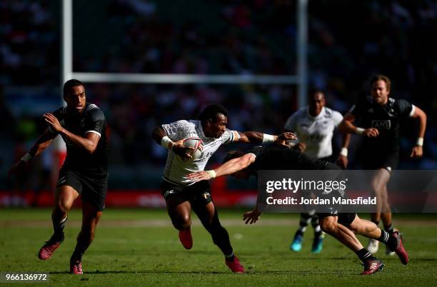 Jerry Tuwai of Fiji is tackled by Tim Mikkelson of New Zealand on day one of the HSBC London Sevens at Twickenham Stadium on June 2, 2018 in London,...