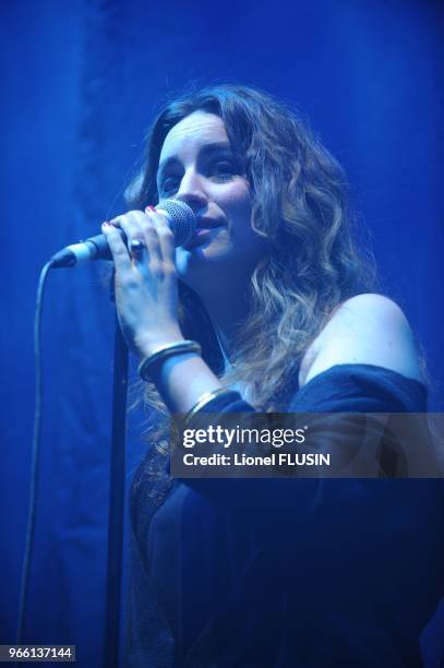 Agathe Moi performs on stage at the Arena of Geneve.