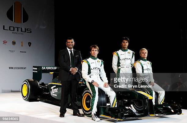 Team Principal Tony Fernandes, Jarno Trulli of Italy, Fairuz Fauzy of Malaysian , Heikki Kovalainen of Finland pose with the new Lotus T127 F1 car...