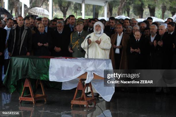 Algerian former President Chadli Bendjedid and current Abdelaziz Bouteflika, Tunisian President Moncef Marzouki and other officials pray behind the...