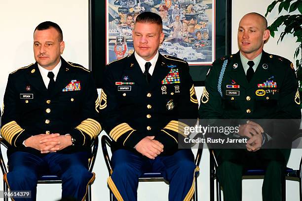 National Guard Sergeants Brian Speach, Chris Dempsey, and Retired Staff Sergeant Heath Calhoun sit on stage during a press conference at Daytona...