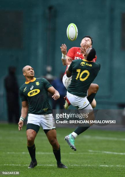 Elton Jantjies of South Africa tackles a Wales player during their Rugby Union international test match at RFK Stadium in Washington, DC, on June 2,...