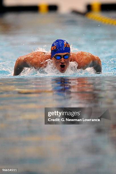 Ryan Lochte swims in the Men's 100 Meter Butterfly preliminaries during day one of the Missouri Grand Prix on February 12, 2010 at the Mizzou Aquatic...