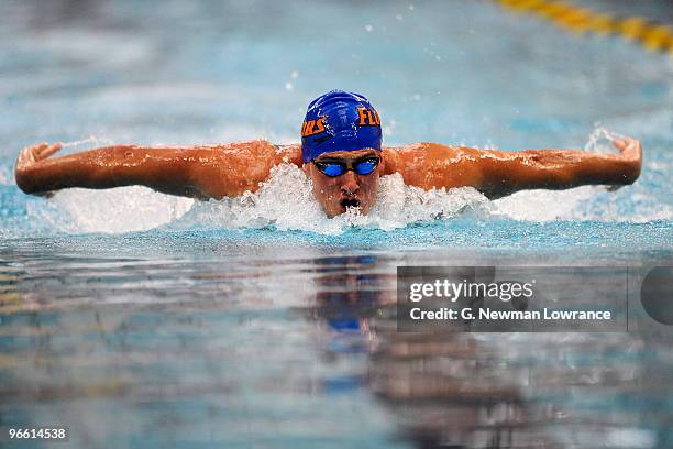 Ryan Lochte swims in the Men's 100 Meter Butterfly preliminaries during day one of the Missouri Grand Prix on February 12, 2010 at the Mizzou Aquatic...