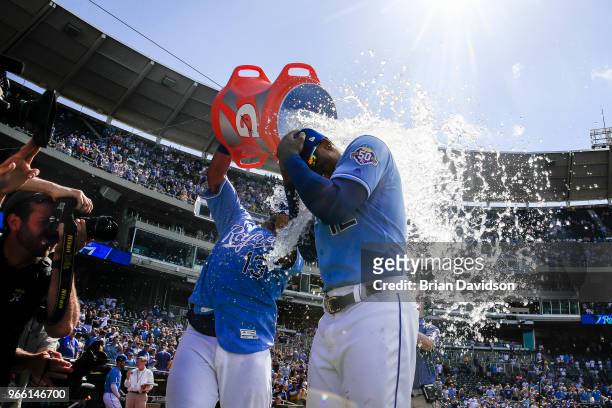 Salvador Perez dumps water on Jorge Soler of the Kansas City Royals after they defeated the Oakland Athletics at Kauffman Stadium on June 2, 2018 in...
