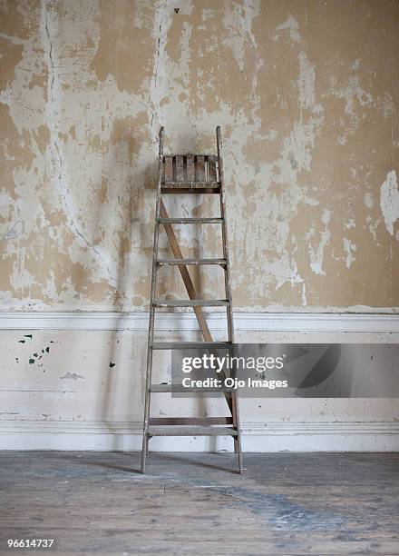 ladder leaning against wall - ladder leaning stock pictures, royalty-free photos & images