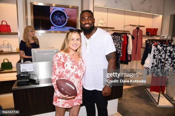 Guests and Landon Collins poses at the Michael Kors & GQ Summer Kickoff With Landon Collins on June 2, 2018 in Short Hills City.