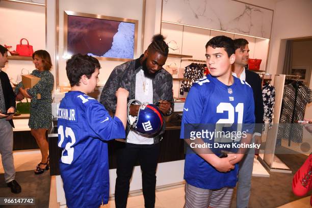 Guests and Landon Collins poses at the Michael Kors & GQ Summer Kickoff With Landon Collins on June 2, 2018 in Short Hills City.