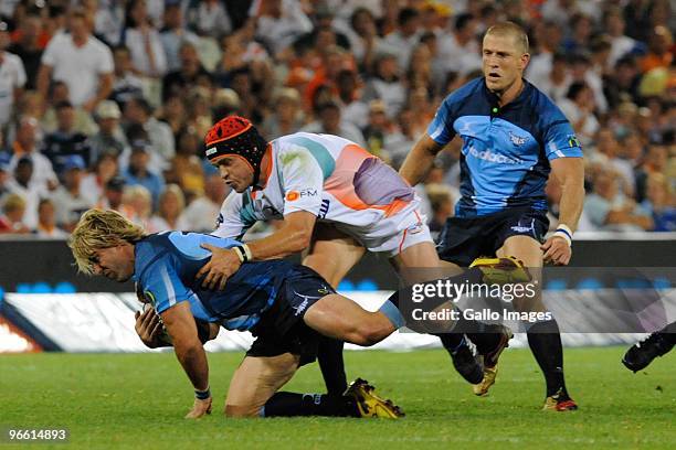 Wynand Olivier and Jaco Pretorius for the Bulls and Corne Uys for the Cheetahs during the Super 14 match between Vodacom Cheetahs and Vodacom Bulls...