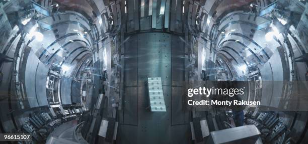 scientist inside a fusion reactor - nuclear fusion stock-fotos und bilder