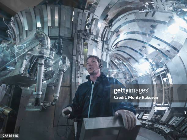 scientist working in a fusion reactor - nuclear power plant interior fotografías e imágenes de stock