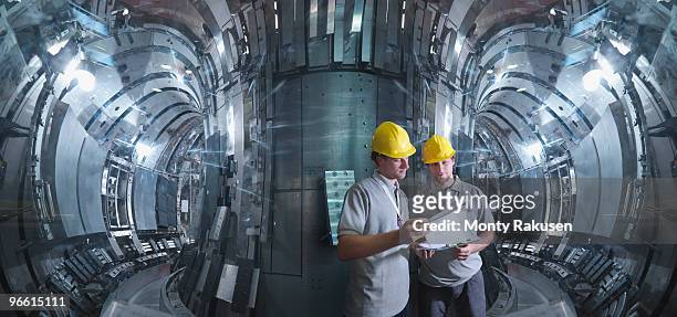 scientists working in a fusion reactor - nuclear power station imagens e fotografias de stock