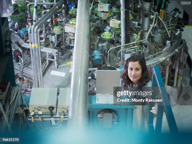 female fusion reactor scientist - nuclear power plant interior fotografías e imágenes de stock