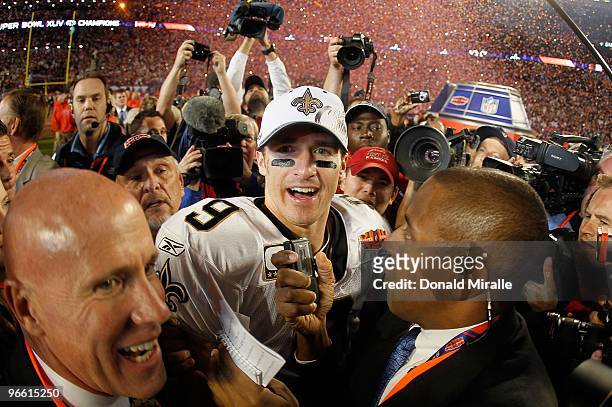 Drew Brees of the New Orleans Saints is interviewed on the field after his team defeated the Indianapolis Colts during Super Bowl XLIV on February 7,...