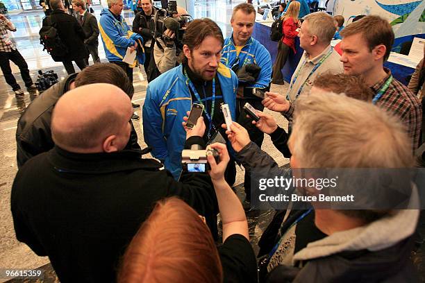 Hockey player Peter Forsberg of Sweden answers questions as he is stopped by reporters at the Main Press Centre during the Vancouver 2010 Winter...