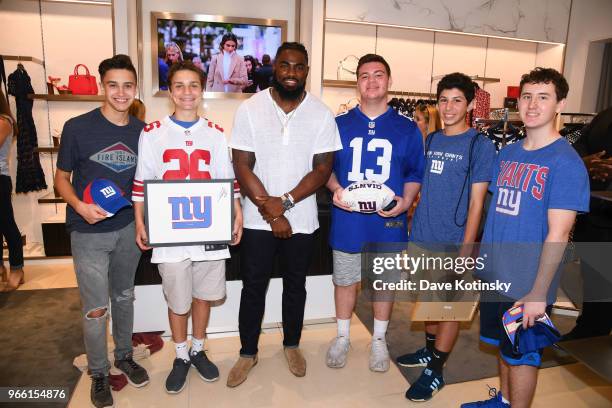 Guests and Landon Collins poses at the Michael Kors & GQ Summer Kickoff With Landon Collins on June 2, 2018 in Short Hills City.