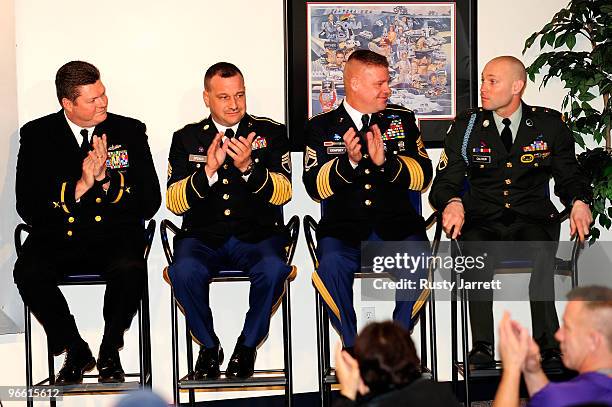 National Guard Sergeants Rick Hudson, Brian Speach, Chris Dempsey, and Retired Staff Sergeant Heath Calhoun sit on stage during a press conference at...