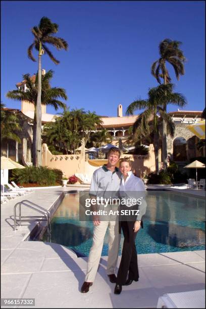 Dani & Ted Virtue standing on the edge of the pool with the Mar-a-Lago Mansion/Club/Residence of Donald Trump behind them during the Donald J. Trump...