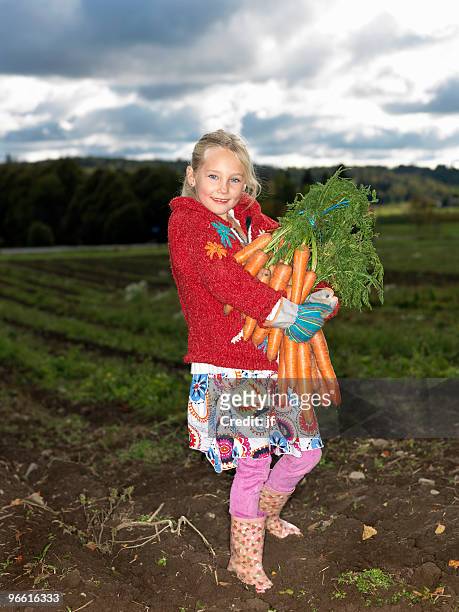 girl with bunch of carrots - girls shoes bildbanksfoton och bilder