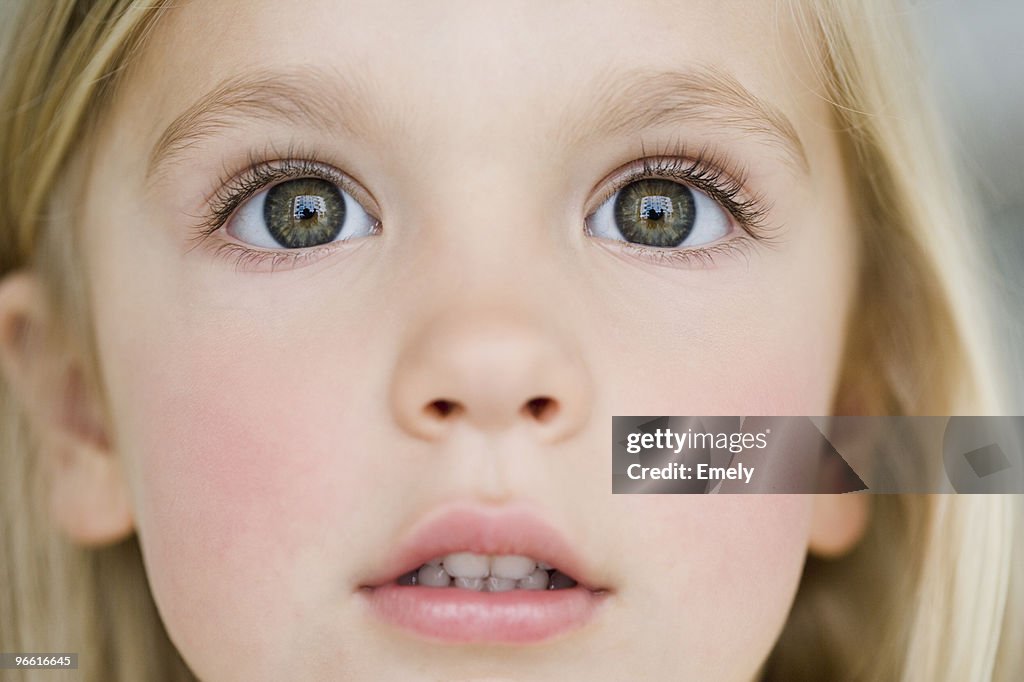 Young girl looking dazzled