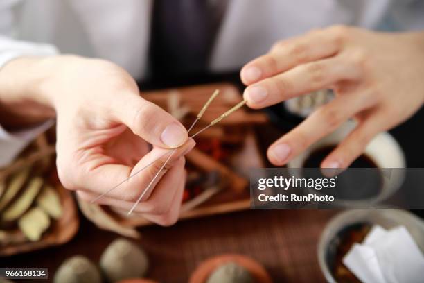 close up of acupuncture needles - angelica hale stock pictures, royalty-free photos & images