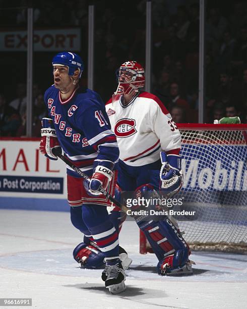 Mark Messier of the New York Rangers positions himself in front of goaltender Patrick Roy of the Montreal Canadiens in the 1990's at the Montreal...