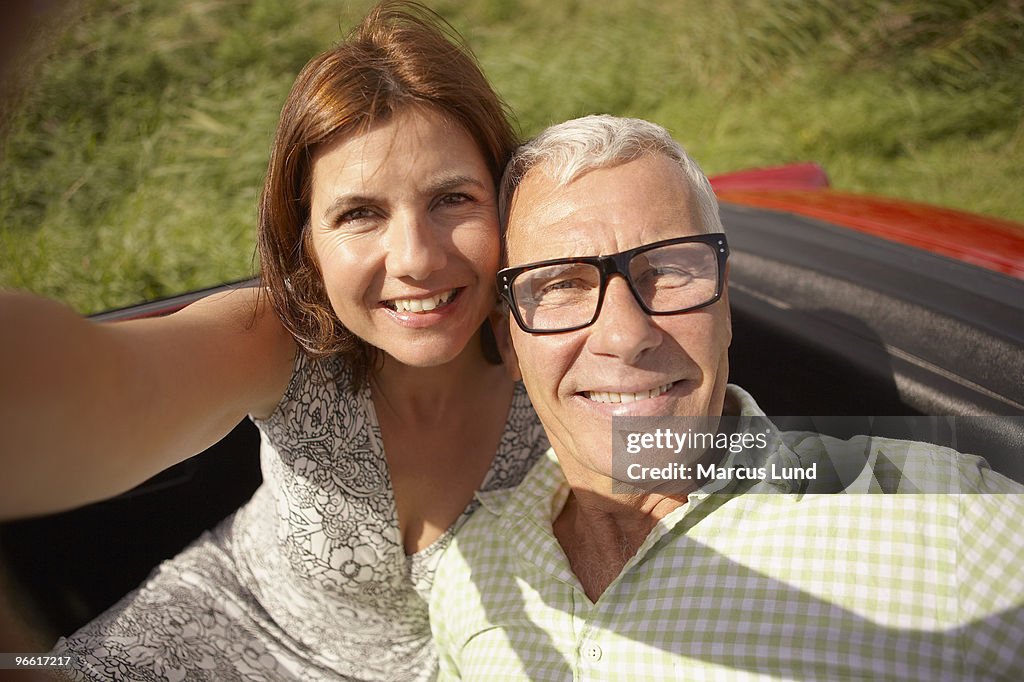 Mid-aged Couple in car self-portrait