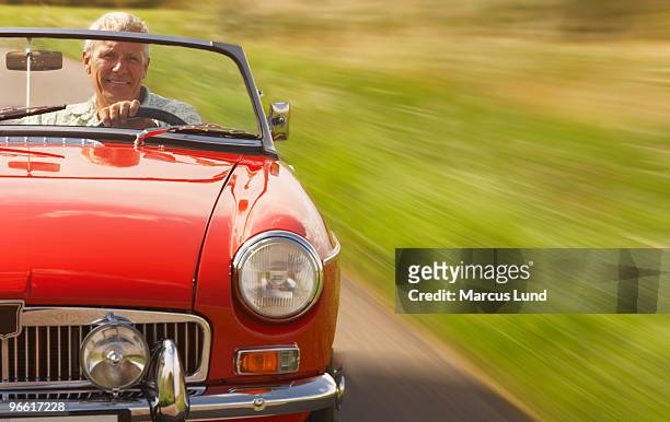 senior man in sports car - old car bildbanksfoton och bilder