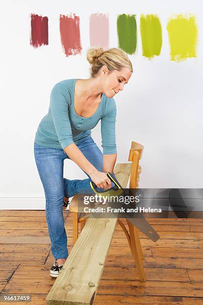 woman sawing plank - sawing stock-fotos und bilder