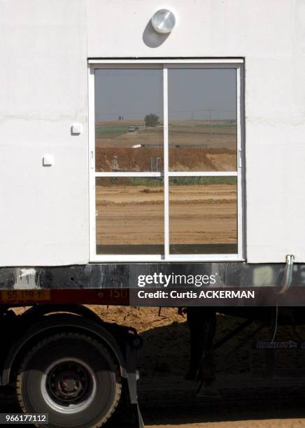 The view of Nitzan through a window of one of the new shipment of 12 pre-fabricated homes intended to serve as temporary housing for settlers...