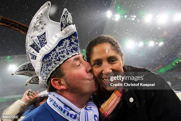 Prince Holger the first of carnival Monchengladbach kisses Steffi Jones, President of the Organising Committee Germany ahead of the Bundesliga match...