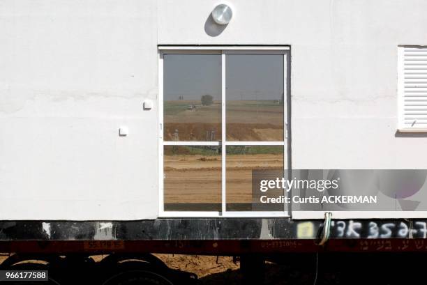 The view of Nitzan through a window of one of the new shipment of 12 pre-fabricated homes intended to serve as temporary housing for settlers...