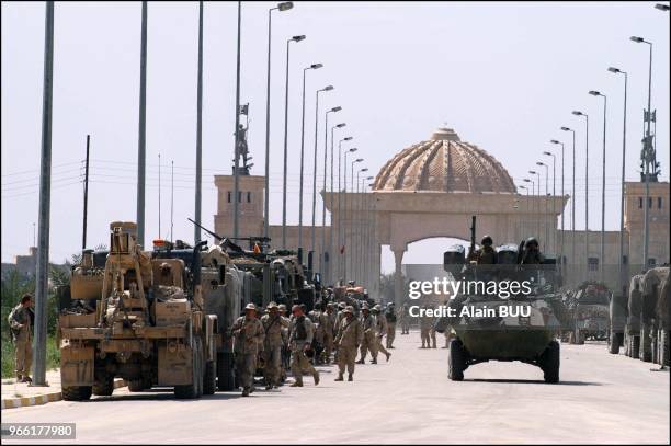 Marines outside Saddam Hussein's palace.