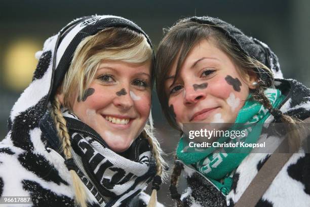 Two fans of Gladbach pose with carnival costumes during the Bundesliga match between Borussia Moenchengladbach and 1. FC Nuernberg at Borussia Park...