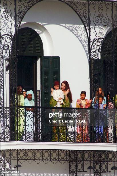 Young prince Moulay Al Hassan takes queen Salma to the Balcony of the Tetuan royal palace while his Highness Mohammed VI delivers his speech.