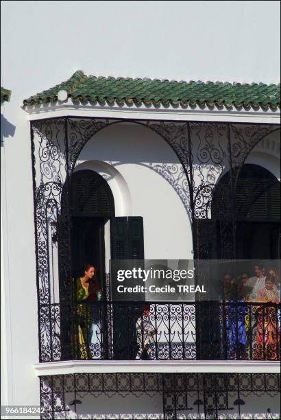 Young prince Moulay Al Hassan takes queen Salma to the Balcony of the Tetuan royal palace while his Highness Mohammed VI delivers his speech.