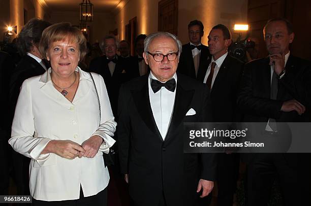 German Chancellor Angela Merkel L) and Hubert Burda, head of the Hubert Burda Media Holding arrive for the Hubert Burda Birthday Reception at Munich...
