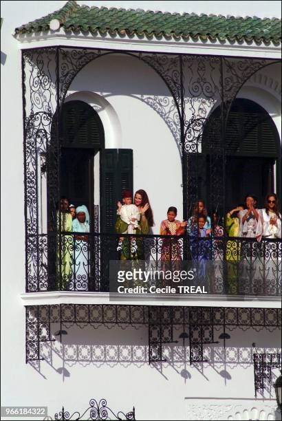 Young prince Moulay Al Hassan takes queen Salma to the Balcony of the Tetuan royal palace while his Highness Mohammed VI delivers his speech.