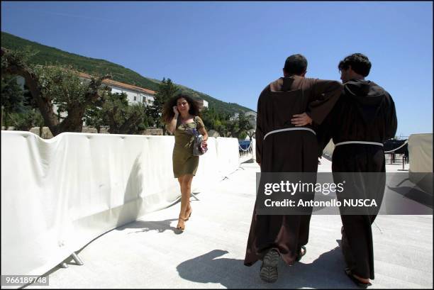 Two monks walk through the square of the new Basilica dedicated to Father Pio, designed by the self-confessed bad boy of European architecture, Renzo...