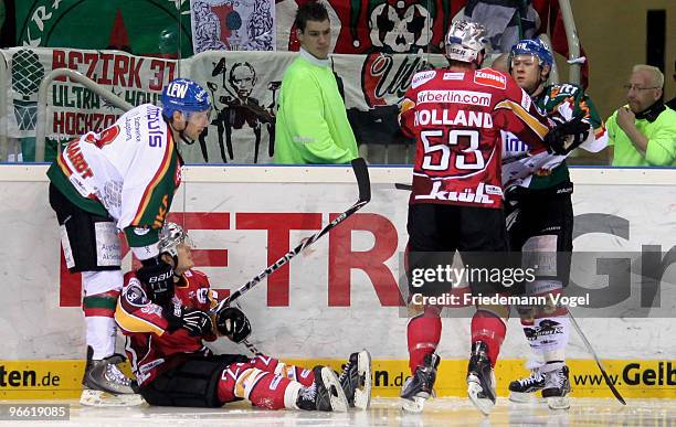 Brett Engelhardt and Matt Ryan of Augsburg in action with Daniel Kreutzer , Jason Holland of DEG Metro Stars during the DEL match between DEG Metro...