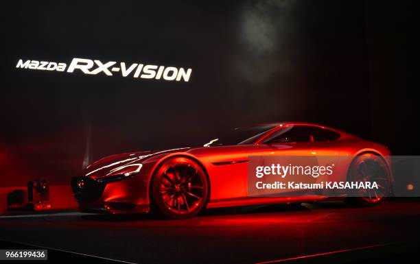 Mazda's new sports concept car " RX-VISION " is unveiled on the stage during the Tokyo Motor Show 2015 press preview day in Tokyo, Oct. 28.