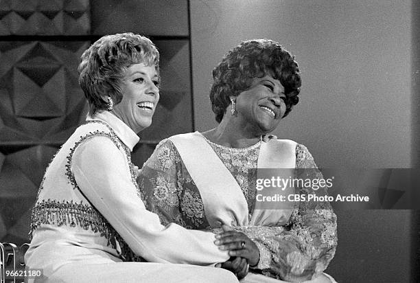 American commedienne and actress Carol Burnett and singer Ella Fitzgerald share a laugh on an episode of the television comedy & variety program 'The...